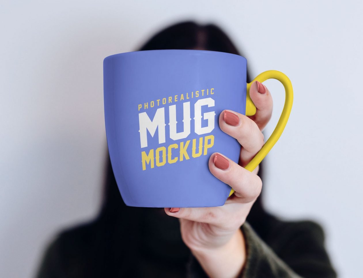 Download Free Mug in Female Hand Mockup PSD | Designbolts