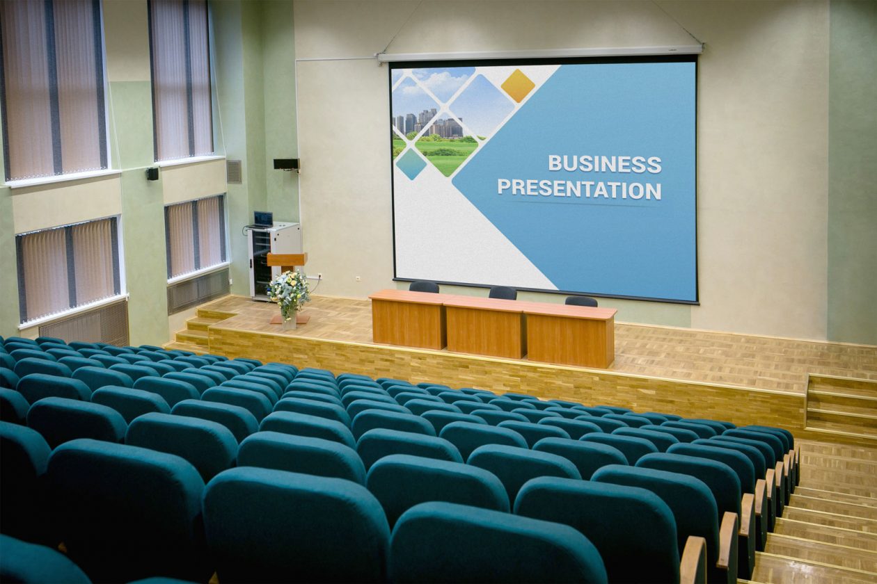 Free Presentation Hall Projector Screen Mockup PSD - Designbolts